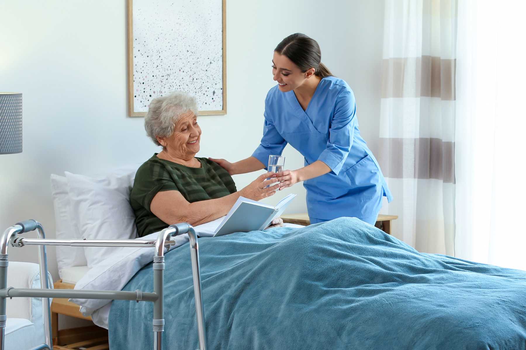 Caregiver assisting patient with recovery exercises