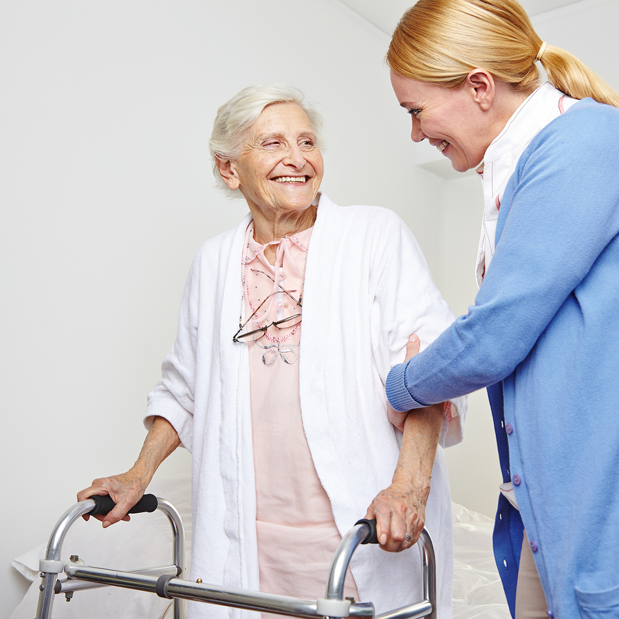 Caregiver assisting senior resident