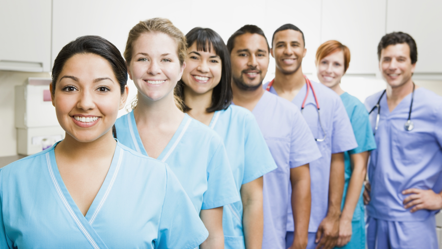 Nurse assisting resident in long-term care facility